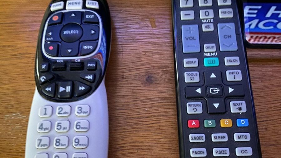 DirectTV satellite TV!  Use the other remote, the TV remote on the right, to turn the TV off/on and use the Direct TV remote to select channels, view guides, etc.