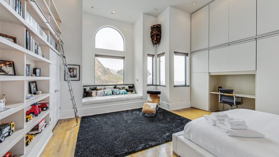 Main floor large bedroom with King bed, across from the shared bathroom. with a view of Tank Hill. 