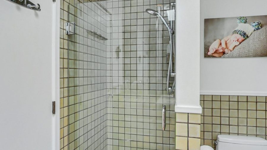 Main floor bathroom.  Large vanity and shower stall. 