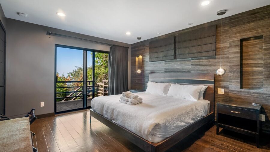 Master bedroom, to the right after descending stairs, with en suite bathroom and walk in closet with laundry room