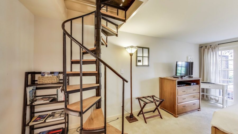 Cozy master suite.  
The spiral staircase leads to the main floor where your hosts live.  Please don't go up the stairs.