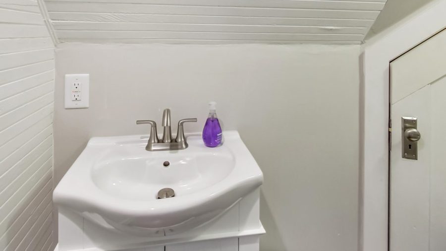 Upstairs hallway watercloset.  Upstairs has a full bathroom and a half bath so people don't have to wait for someone in the shower to brush teeth or other important business