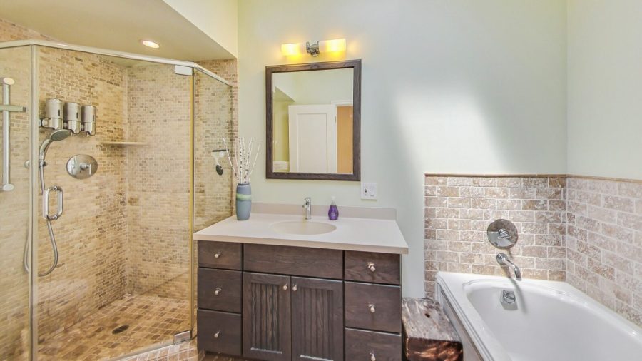 Bathroom with shower and bathtub.