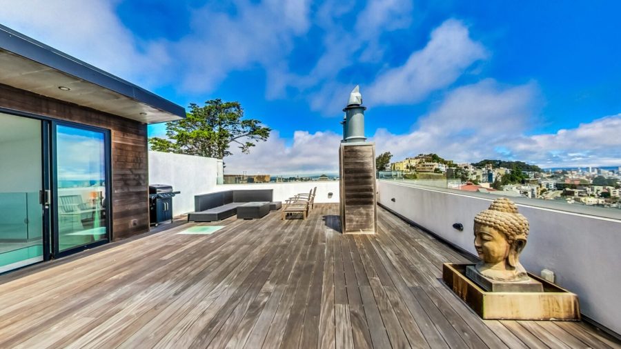 Rooftop deck with seating area, steam room, half bath and panoramic bay view.