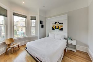 Business-ready room faces Castro St with DISH Network TV - need a desk? Just flip up the bed :-)
