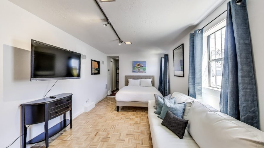 The studio room is very spacious. with a Queen size bed, large sofa, Desk and Television.