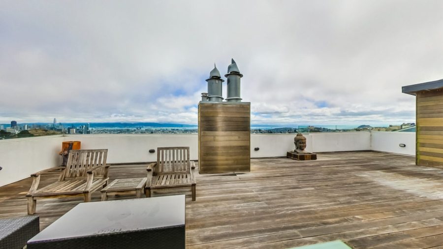 Rooftop deck with seating area, steam room, half bath and panoramic bay view.