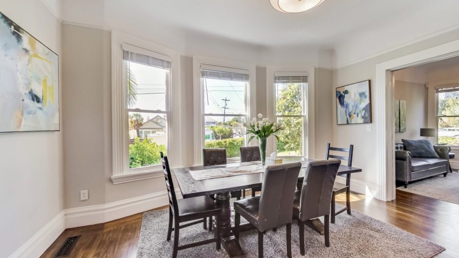 Spacious dining room with decorative fireplace and plenty of room for Eight people
