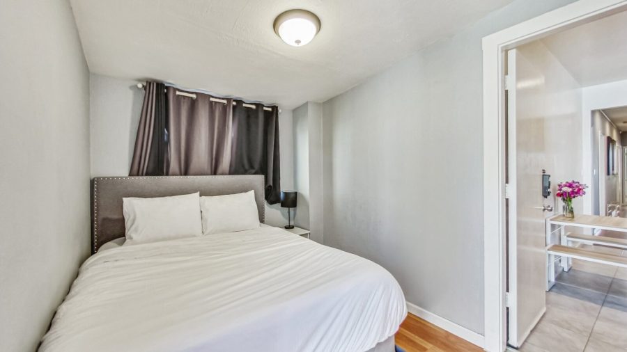 The smaller bedroom off the back of the kitchen has a full bed and is perfect for someone that needs a darker room to sleep.
