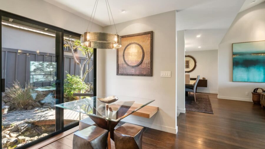 Breakfast nook in kitchen and dining room in the background