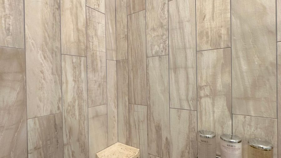 The ensuite bathroom in the master bedroom features a rain shower and Kiehl's shampoo, conditioner, and body wash
