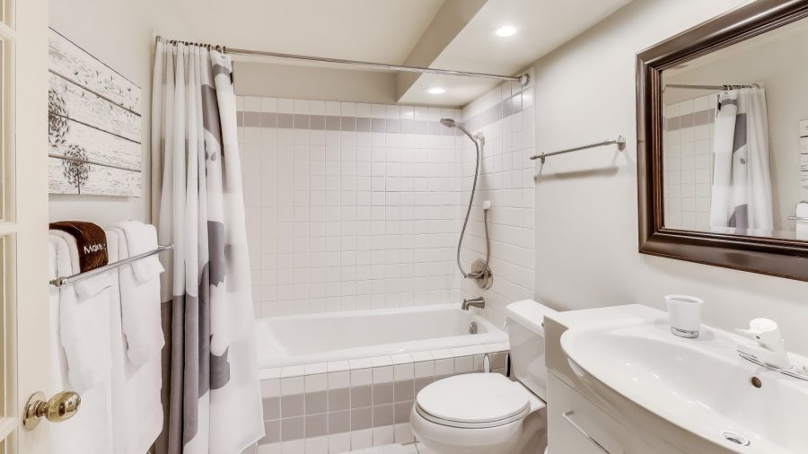 Bathroom with shower over tub