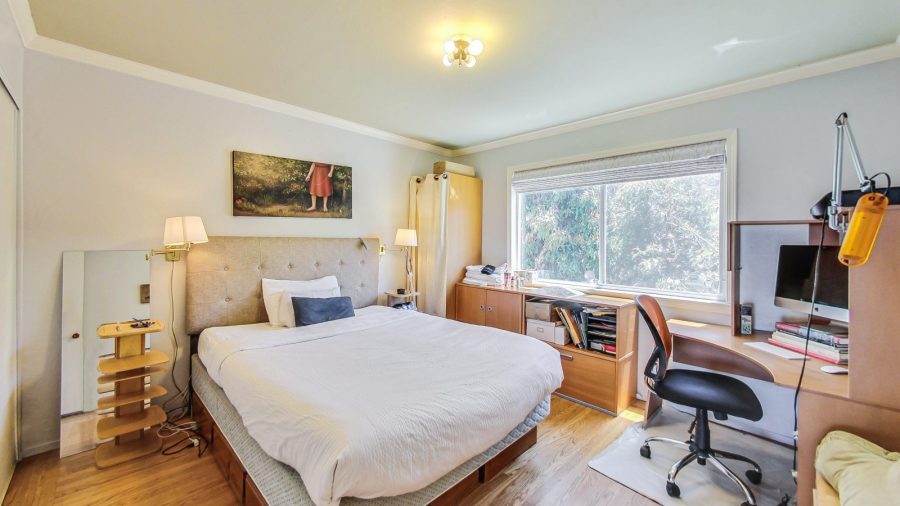 Main bedroom has a comfy bed and a desk to work.