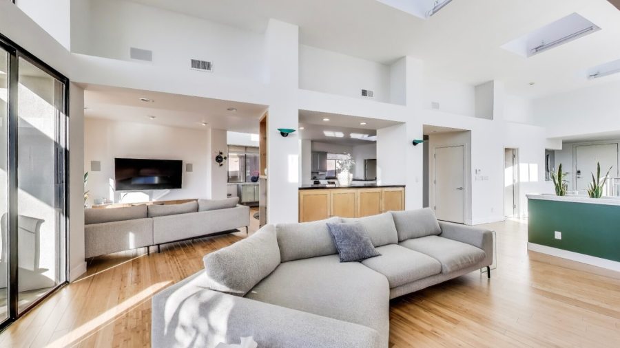 The upstairs living level features an expansive  open floor plan with high ceilings and tons of natural light