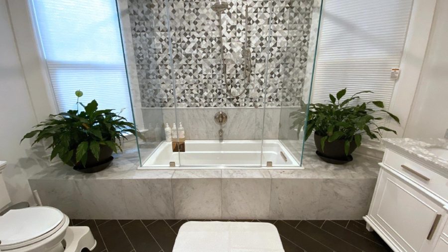 Inside the Master Bedroom Suite... Master bathroom with shower, tub and generously sized  double-sink vanity...
