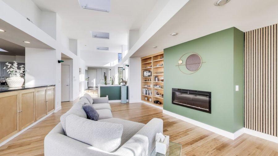 Spacious living room with electric fireplace. 
