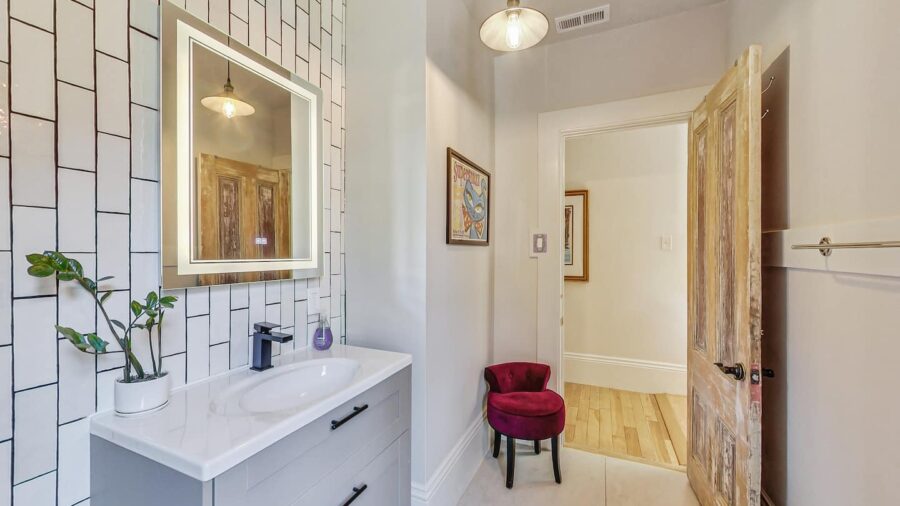 The hallway bathroom has been recently remodeled and has a standards sized shower stall with rainfall shower head.