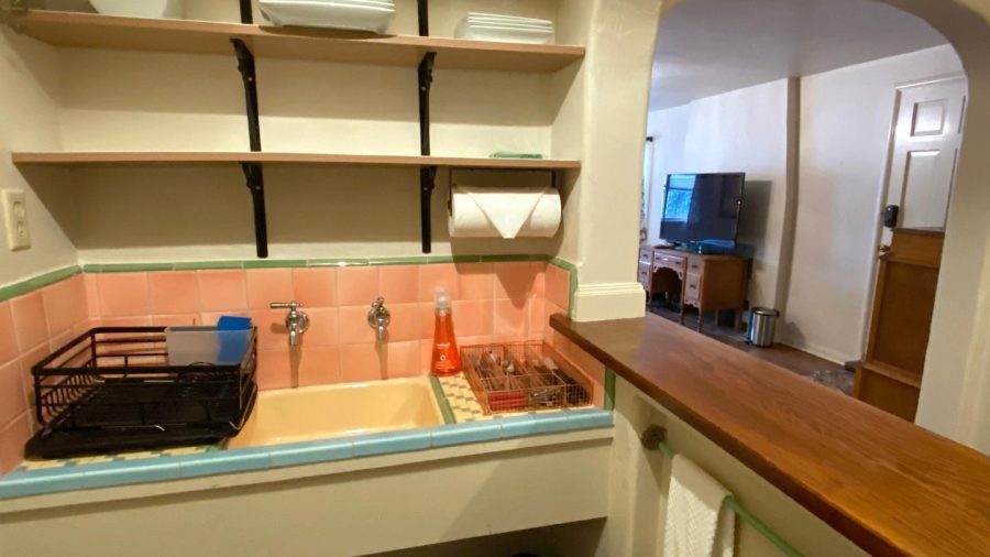 Kitchenette with sink, silverware and dishes...