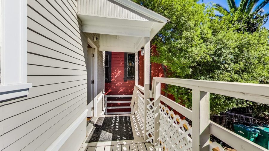 back porch/balcony overlooking the back yard. 