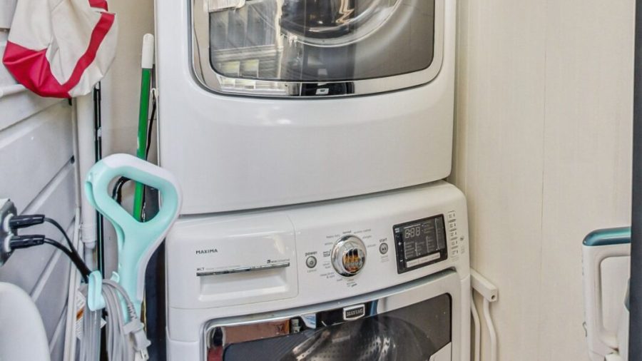 Laundry room just off the kitchen with newer model Washer & Dryer 