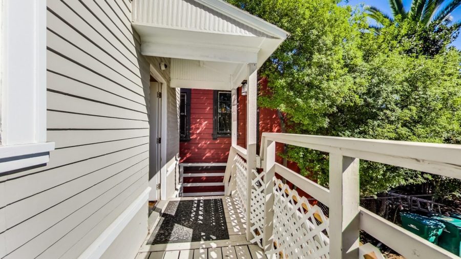 back porch/balcony overlooking the back yard. 