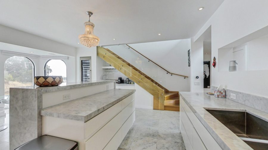 Eat in chefs kitchen.   
Stairs to upper bedroom and roof top deck. 