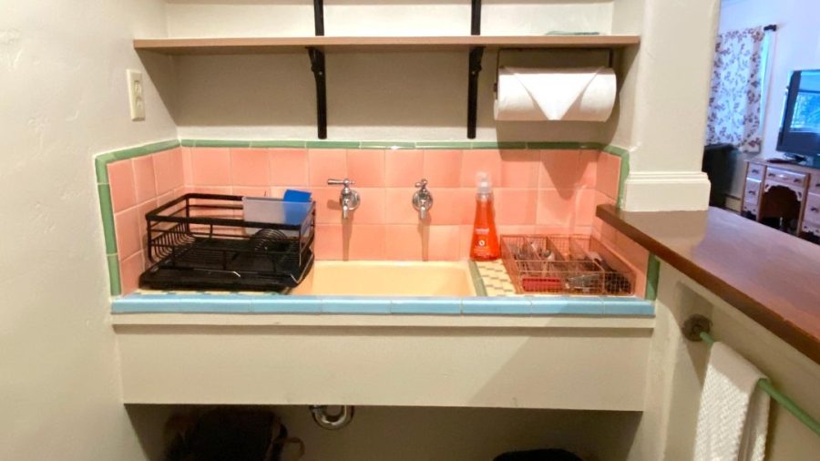 Kitchenette with sink, silverware and dishes...