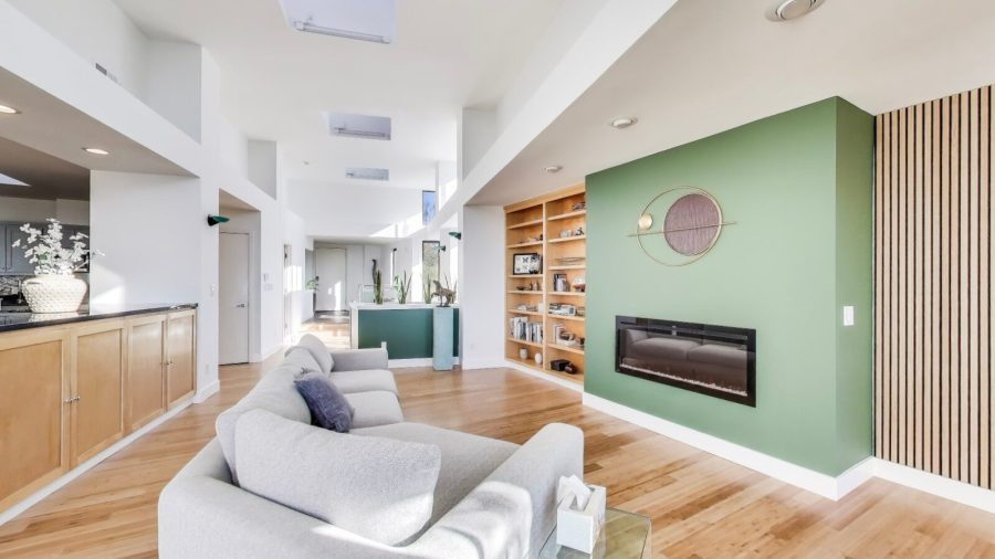 Spacious living room with electric fireplace. 