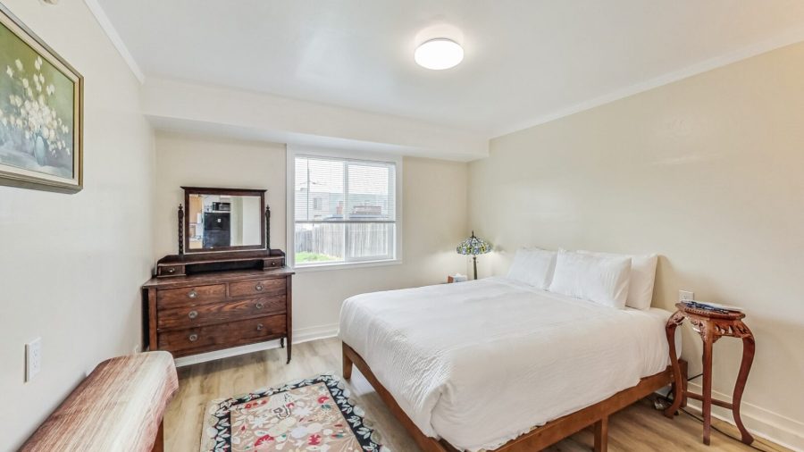 Spacious bedroom with window onto the back yard
