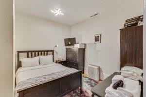 Cozy windowless room.  There is a ceiling fan which evacuates area and brings in fresh air from the house. 
This bed will be changing to a Twin over Full bunk bed with under dressers to make better use of the cozy room.