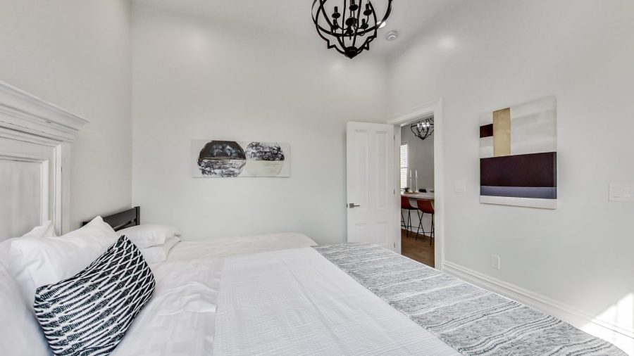 Master bedroom is off the kitchen.