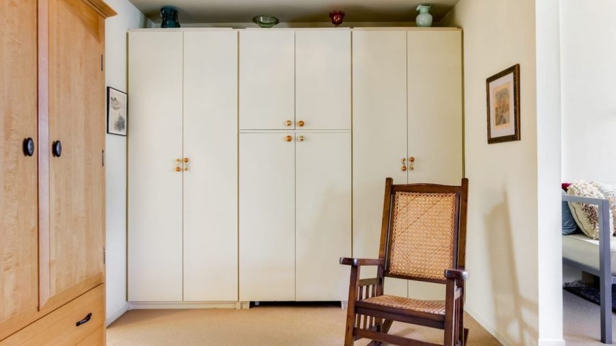 Master bedroom with wall of closet space