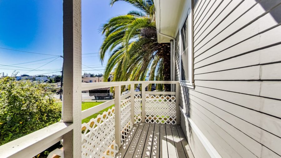 back porch/balcony overlooking the back yard. 
