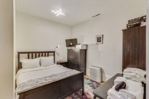 Cozy windowless room.  There is a ceiling fan which evacuates area and brings in fresh air from the house. 
This bed will be changing to a Twin over Full bunk bed with under dressers to make better use of the cozy room.