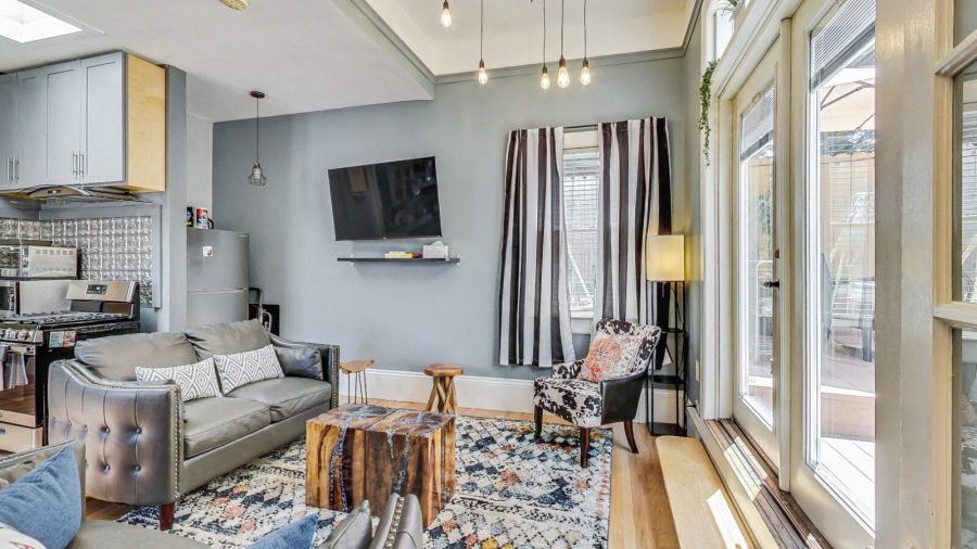 Spacious living room with television--you can watch the news or your own streaming service while cooking in the kitchen
