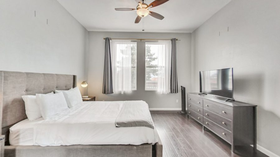The master bedroom features a walk in closet, ensuite bathroom, and a Samsung smart TV with Airplay capabilities and streaming apps