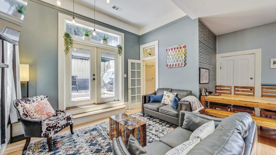 Spacious living room section of open concept living/dining/kitchen area