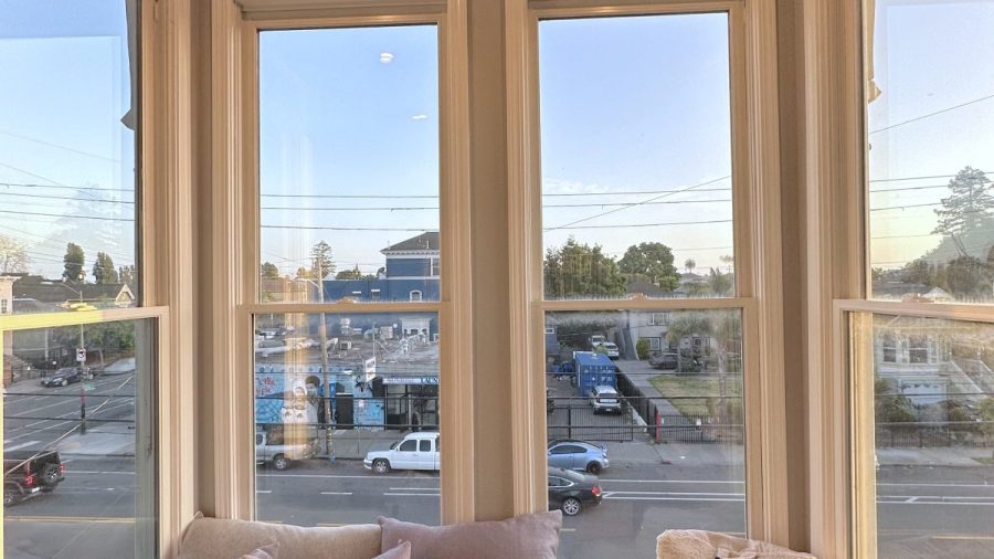 The living room features a cozy bay window with ample light and sunshine; take a break in the sunshine or relax and read a novel