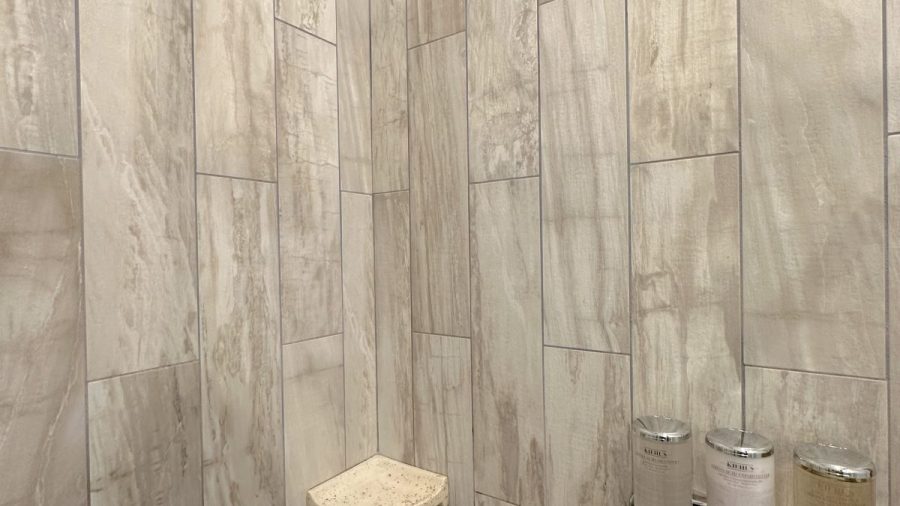 The ensuite bathroom in the master bedroom features a rain shower and Kiehl's shampoo, conditioner, and body wash