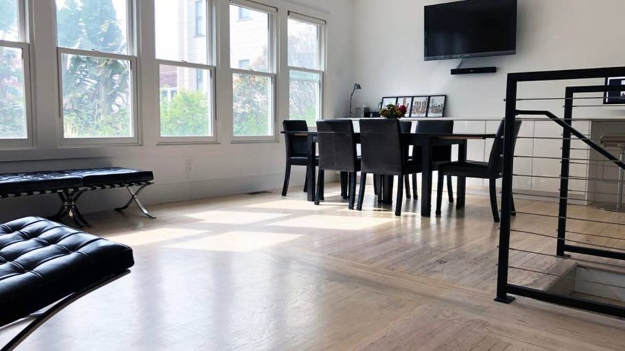 The upper level is open concept with living room, dining room, and kitchen
