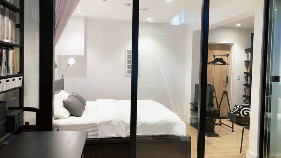 Modern Japanese inspired doors slide to close off the bedroom