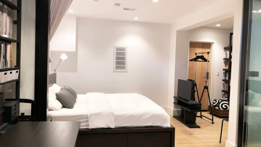Modern Japanese inspired doors slide to close off the bedroom