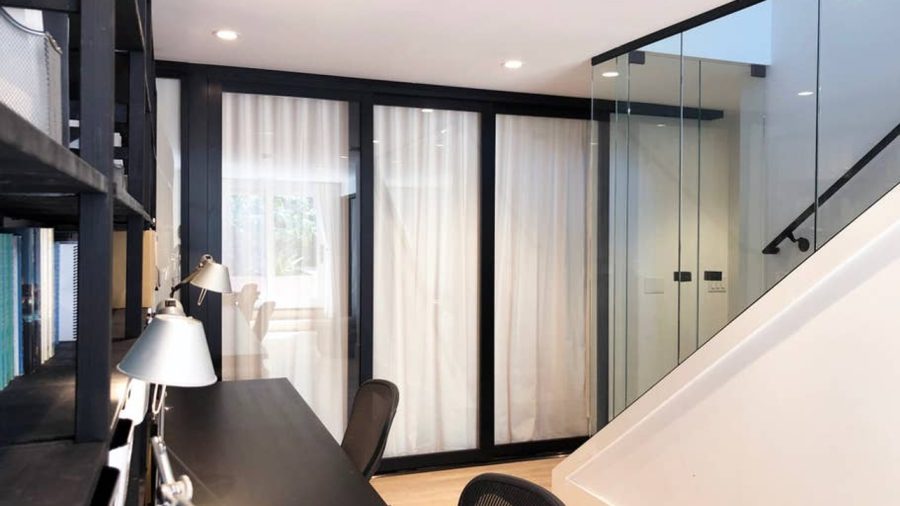 Modern Japanese inspired doors slide to close off the bedroom