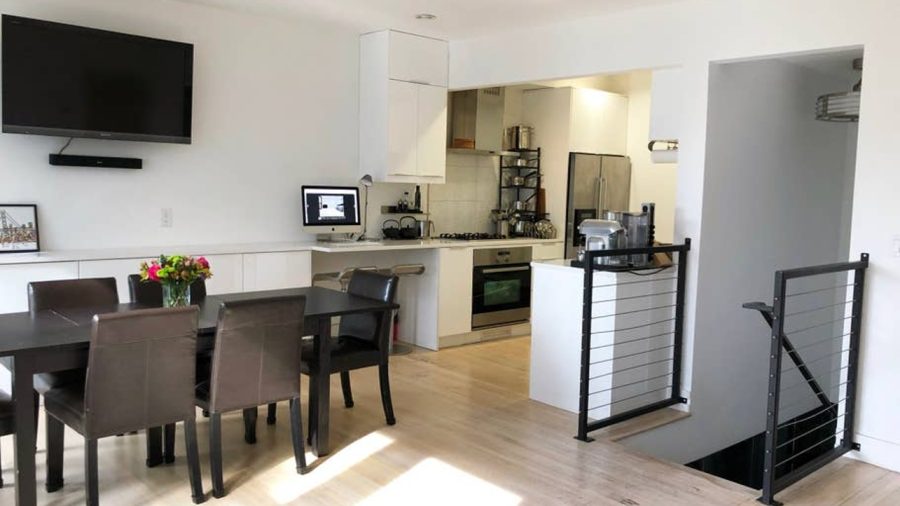 The upper level is open concept with living room, dining room, and kitchen