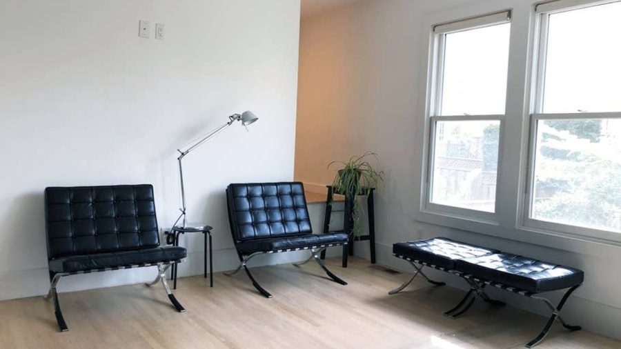 The upper level is open concept with living room, dining room, and kitchen