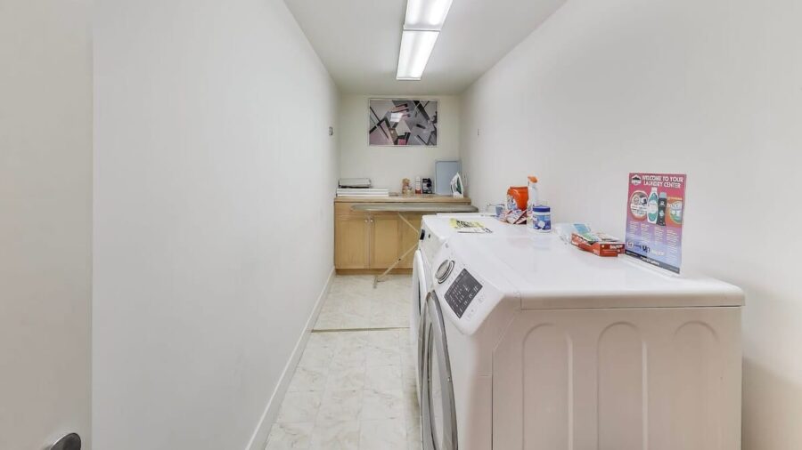 Laundry room with front loader washer & Dryer.  We provide Tide laundry detergent for your use.