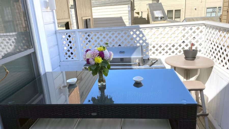 Outdoor terrace with BBQ grill seats 6... perfect for enjoying  warm days/evenings.  Shared area. There's a slight view of downtown if you look hard enough...