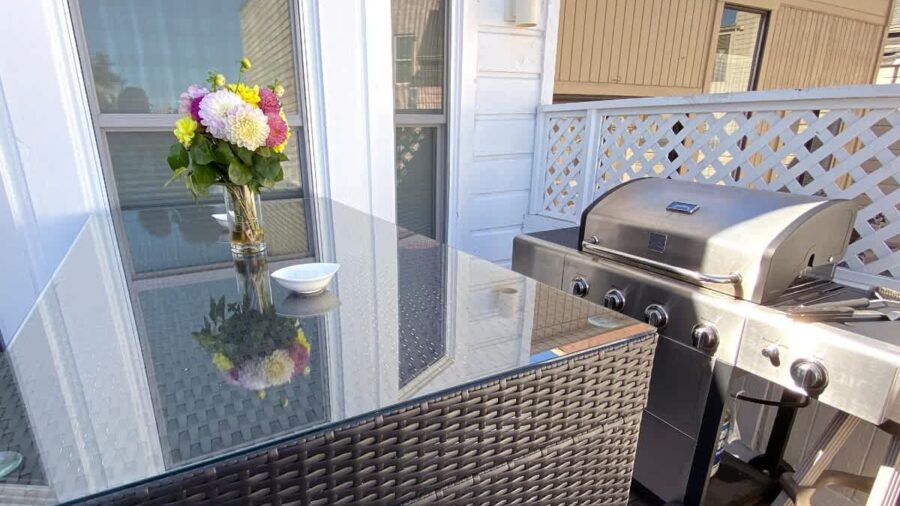 Outdoor terrace with BBQ grill seats 6... perfect for enjoying  warm days/evenings.  Shared area. There's a slight view of downtown if you look hard enough...