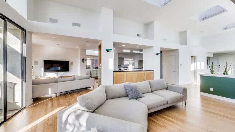 The upstairs living level features an expansive  open floor plan with high ceilings and tons of natural light