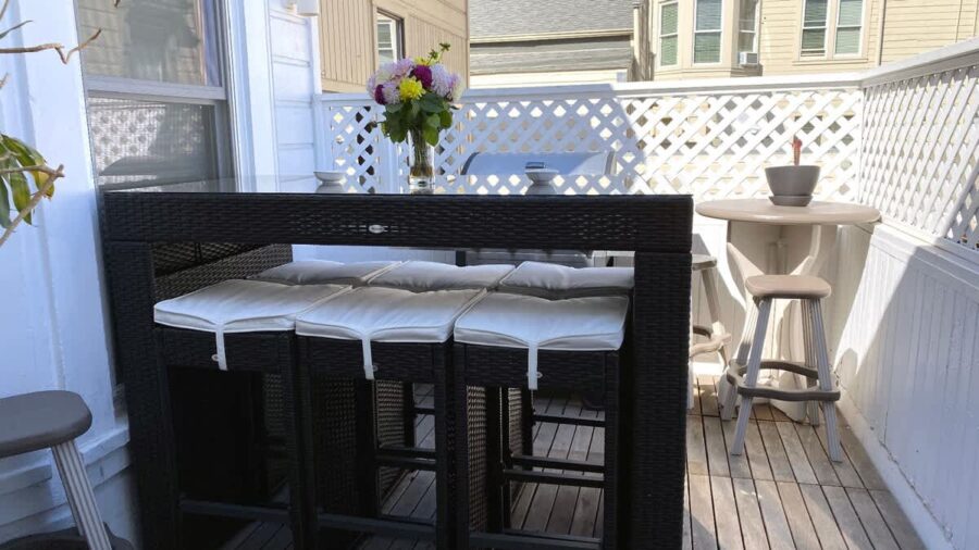 Outdoor terrace with BBQ grill seats 6... perfect for enjoying  warm days/evenings.  Shared area. There's a slight view of downtown if you look hard enough...